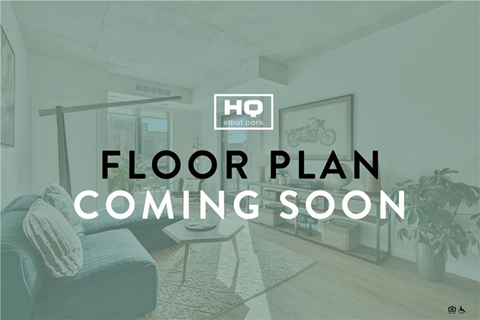 A room with a couch, a table, and a plant, with text overlay that reads "FLOOR PLAN COMING SOON".