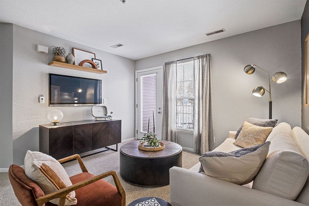 a living room with a couch and a tv