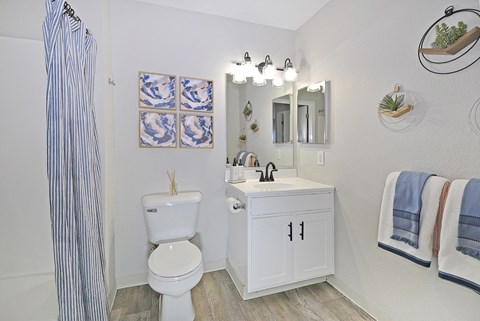 a bathroom with a toilet and a sink