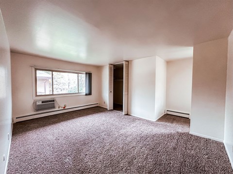 A room with a window and a door.