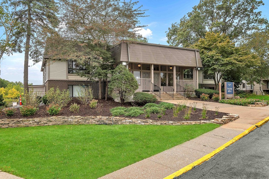 a house with a sidewalk in front of it