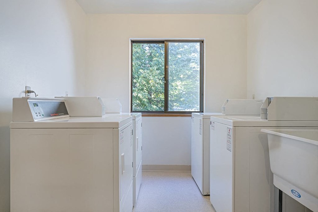 a washer and dryer in a room with a window