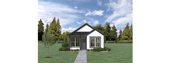 a home with a green lawn and trees in the background