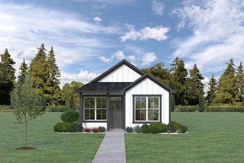 a home with a green lawn and trees in the background