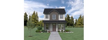 a home with a green lawn and trees in the background