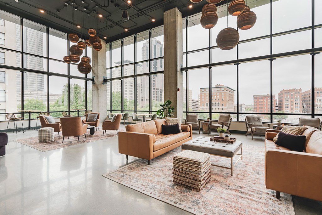 lounge area with large tall windows and sofas