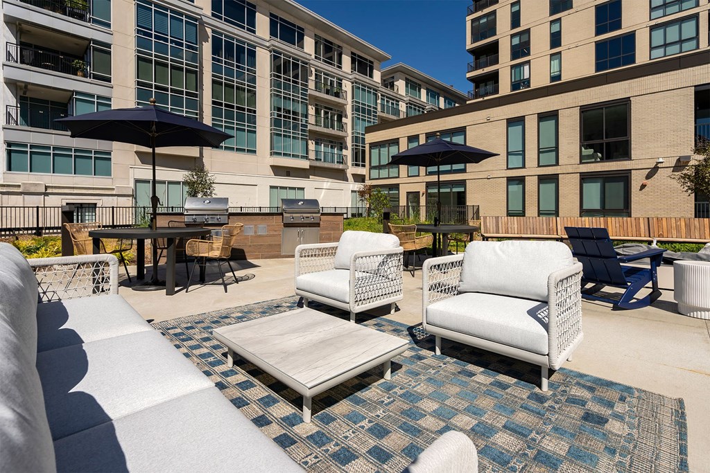 outdoor rooftop lounge with sofas and chairs