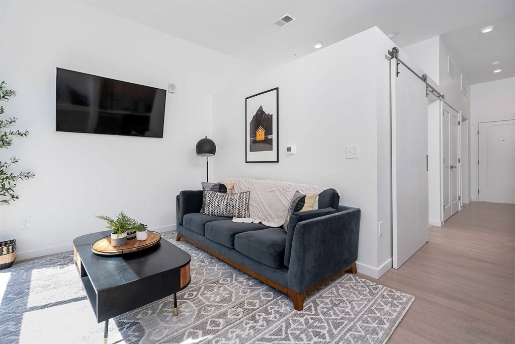 a living room with a couch and a tv
