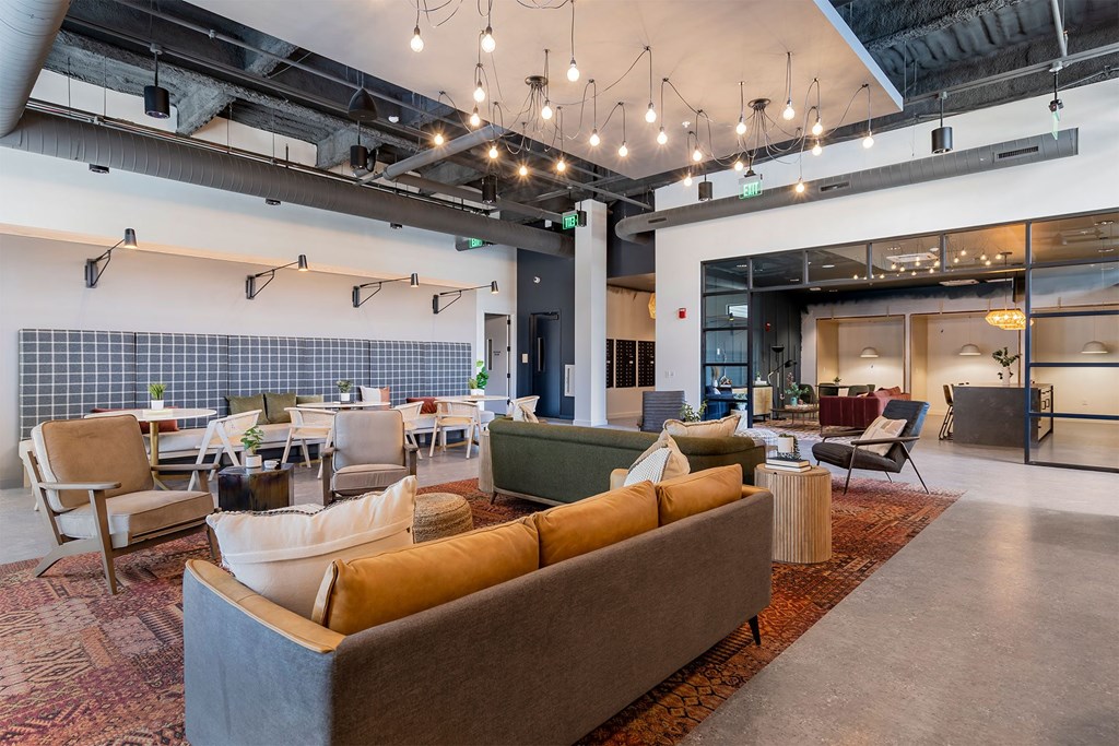 a large lobby with couches and chairs and tables