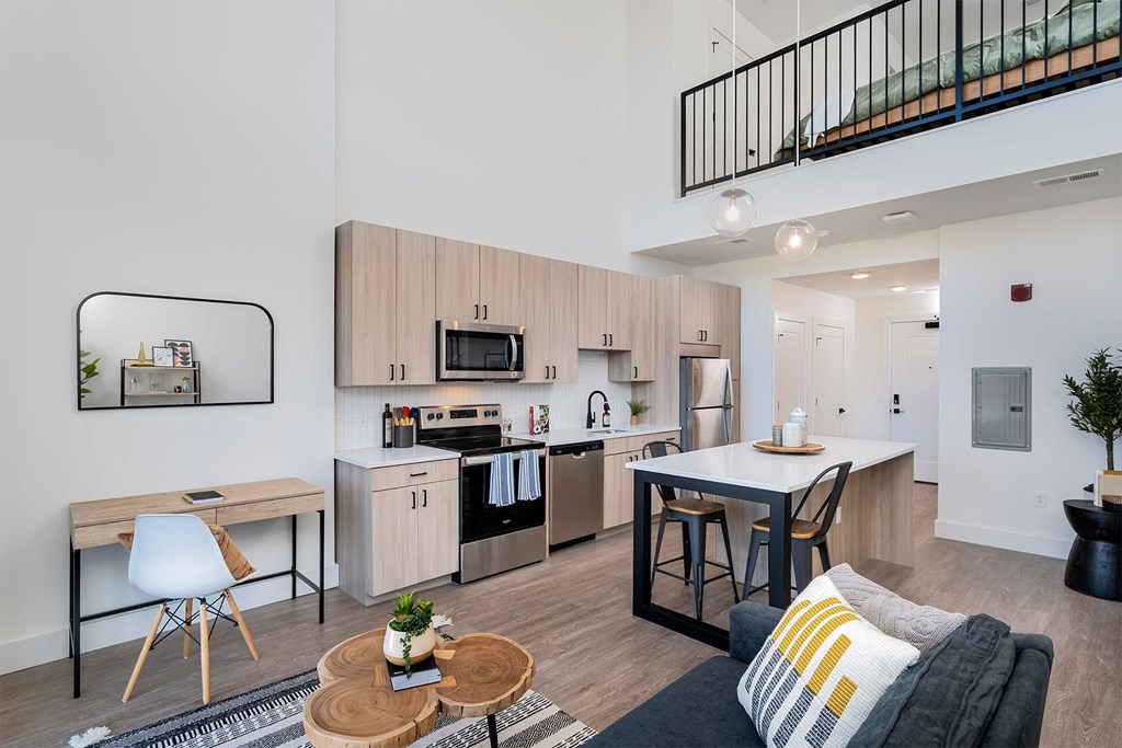 a living room with a kitchen and a dining room