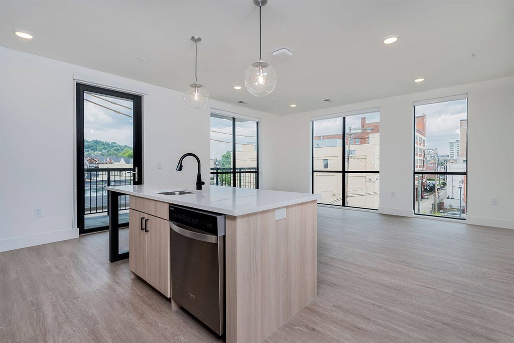 a kitchen with a large island in the middle of it