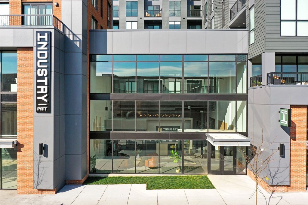 a view of the front of a building with large glass windows