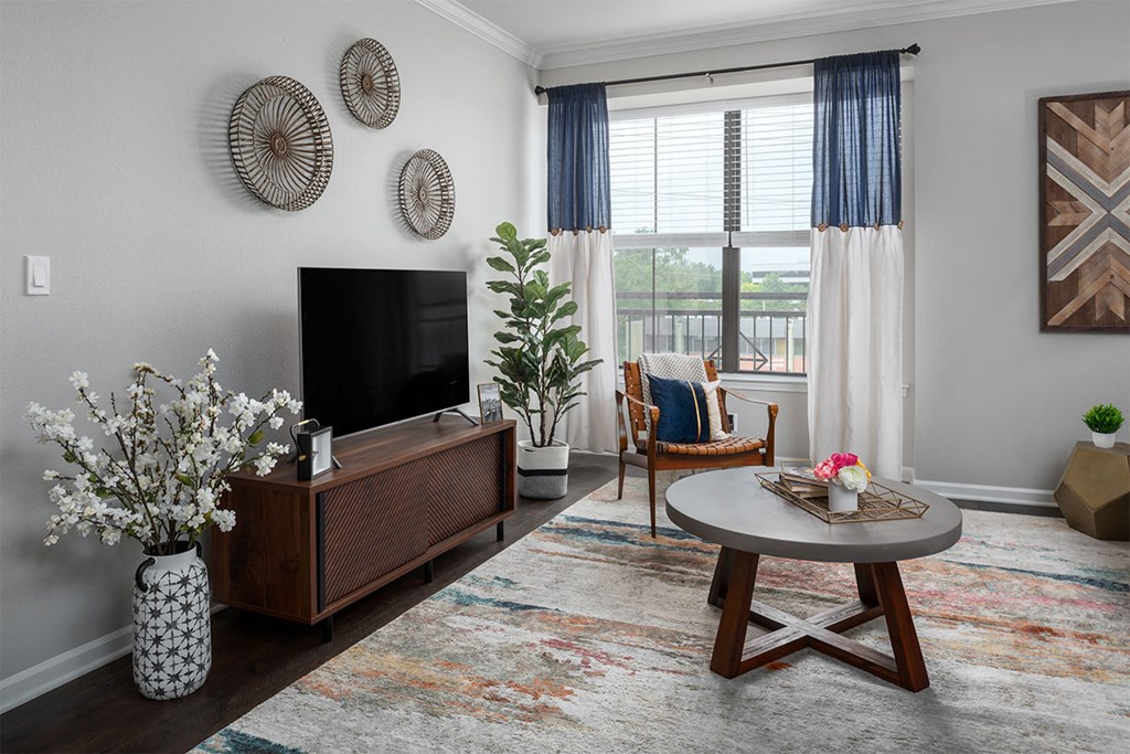 a living room with a tv and a table