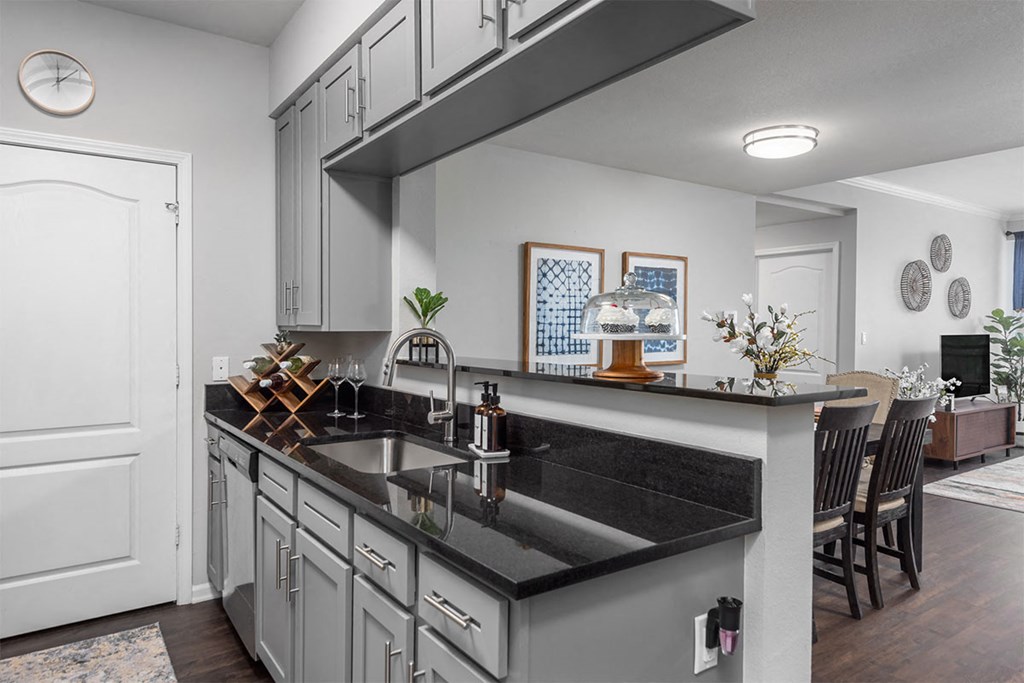 a kitchen with a large counter top and a sink