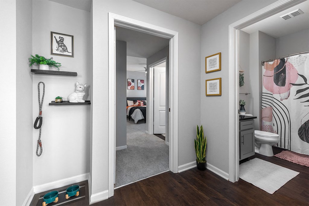 a hallway with a bathroom and a closet      and a bedroom