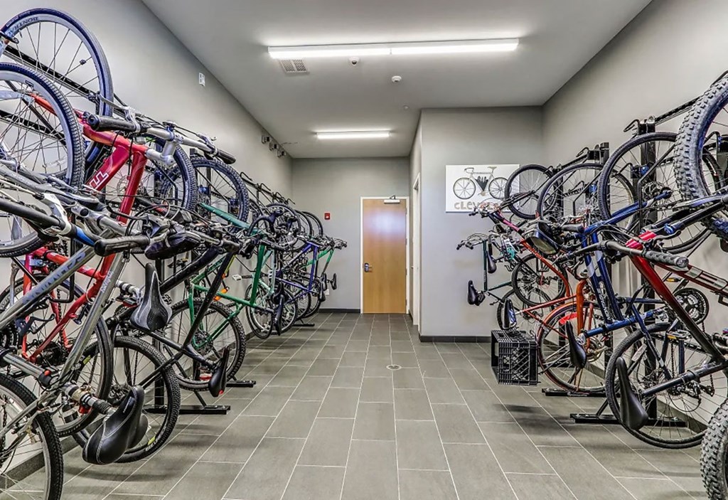 A room full of bicycles parked in a bike shop.