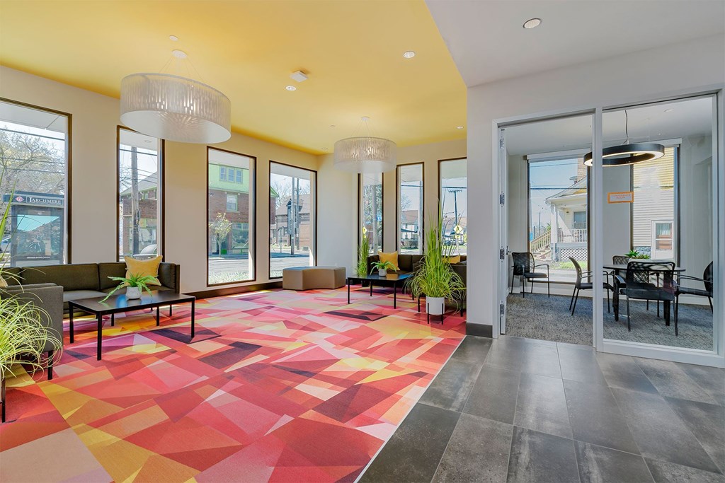 A brightly lit room with a red and yellow floor.