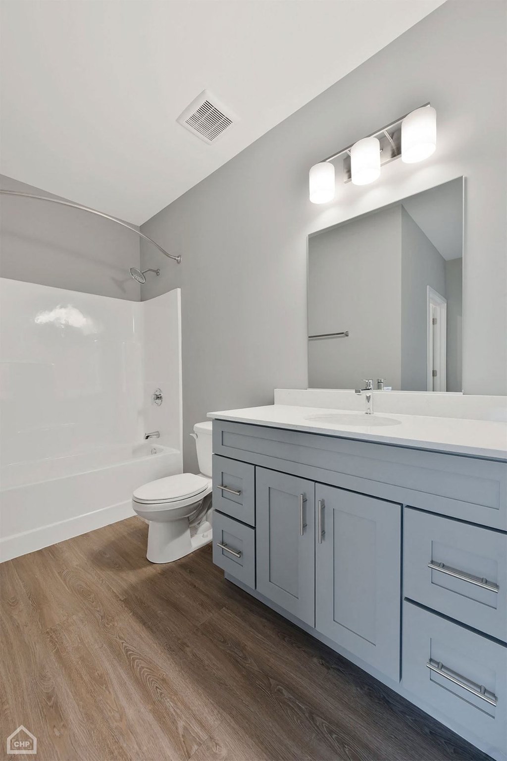 a white bathroom with a toilet and a sink
