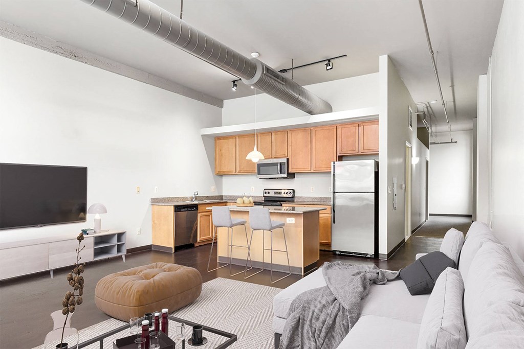 a living room with a kitchen and a couch