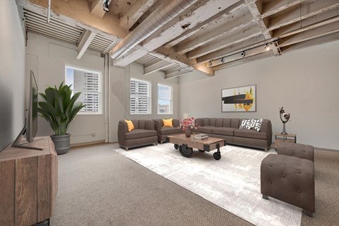 A living room with a brown couch and a wooden cabinet.