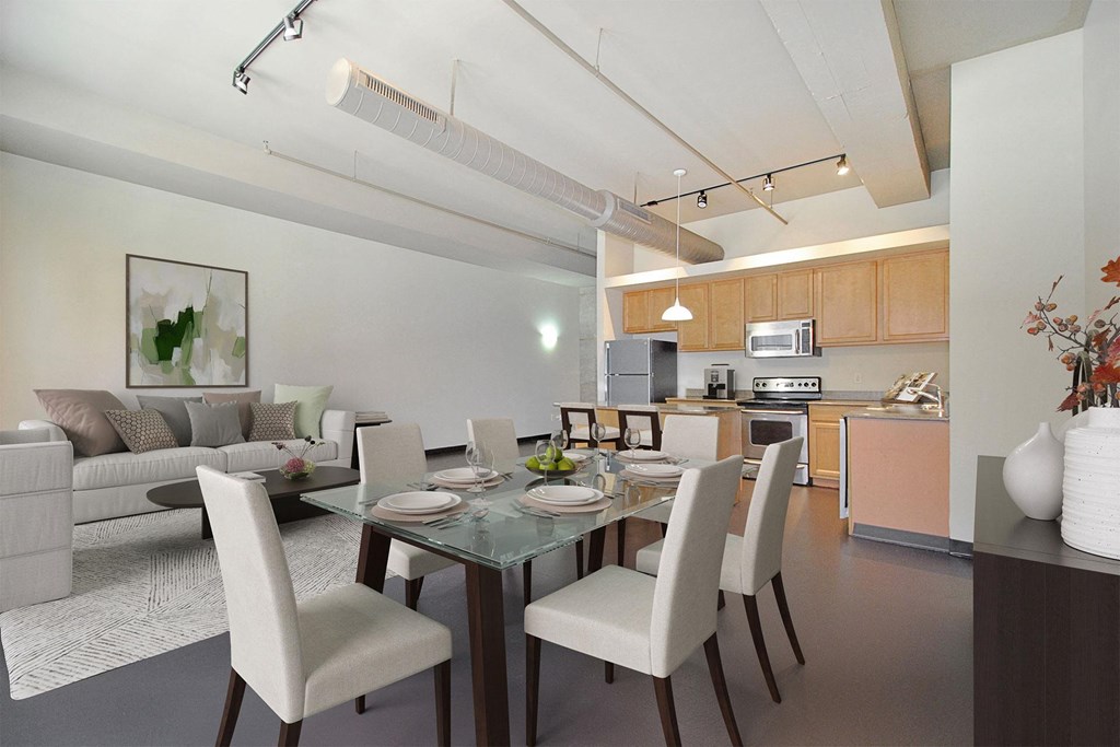 a living room and dining room with a table and chairs