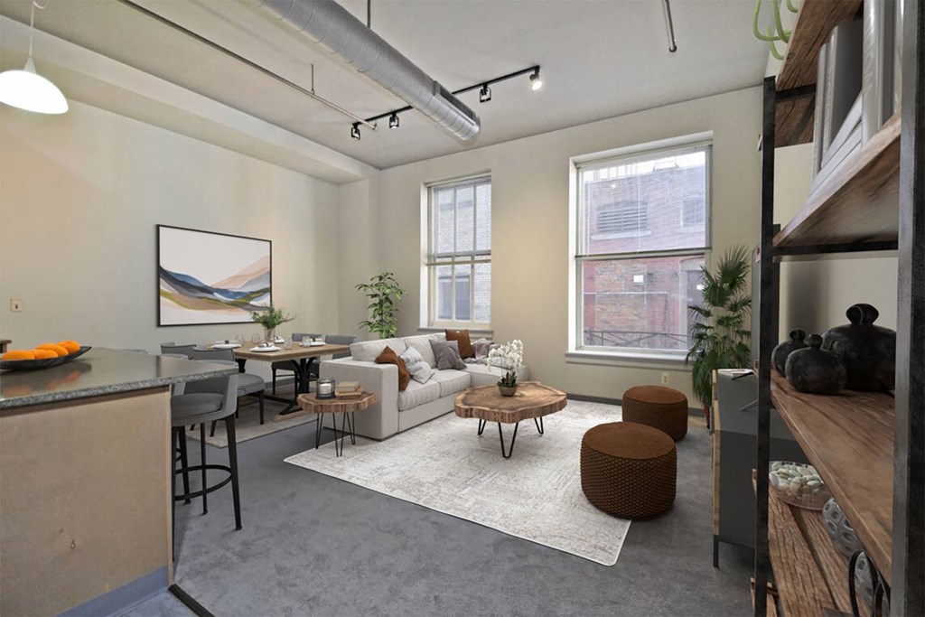 the living room of an apartment with a couch and a table