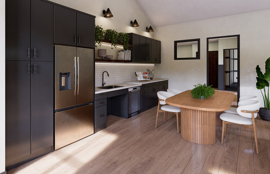 a kitchen with stainless steel appliances and a wooden table