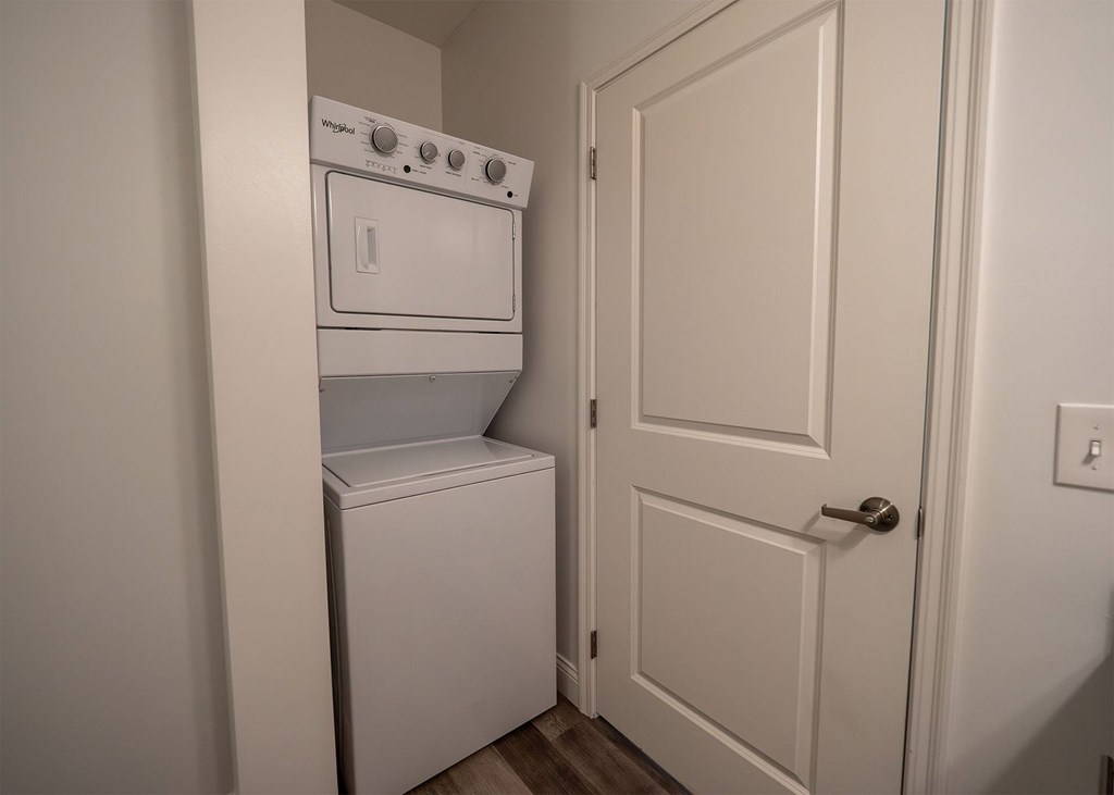 A white oven and dishwasher in a small kitchen.