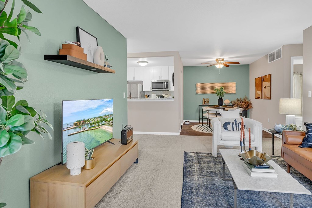 A living room with a television and a couch.
