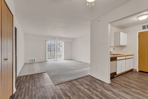 A room with wooden floors and white walls.