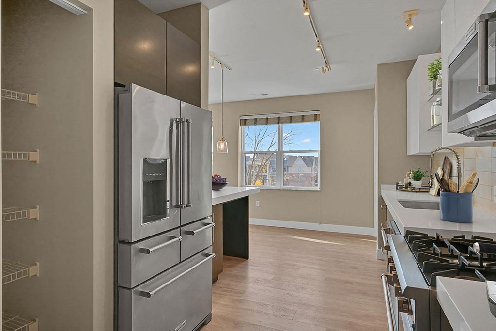 a kitchen with stainless steel appliances and a window