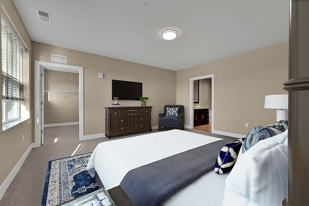 a bedroom with a bed and a dresser