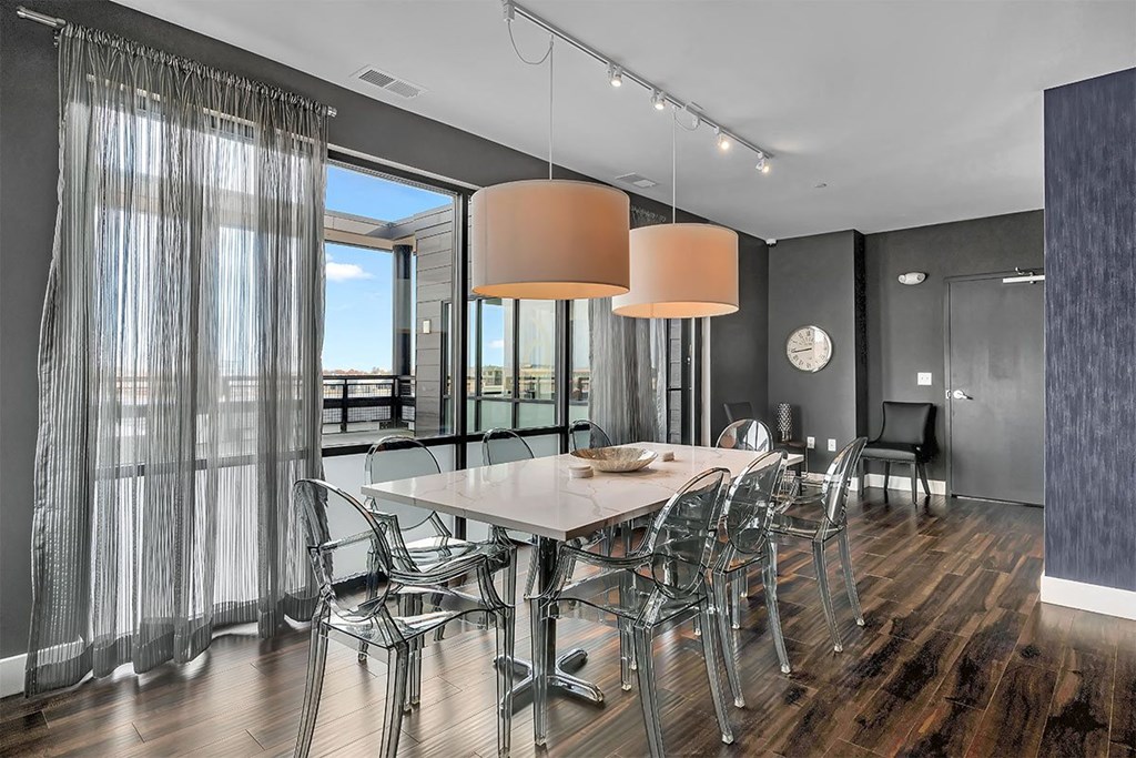 a dining room with a table and chairs