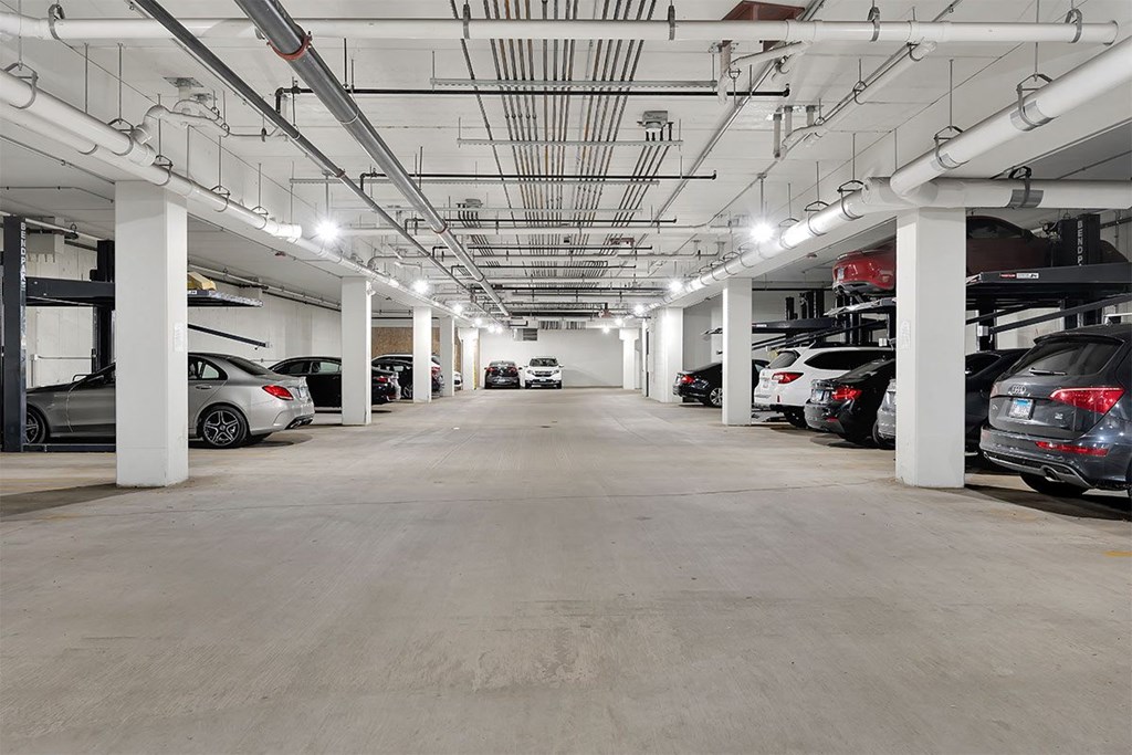 a parking garage with cars parked in it