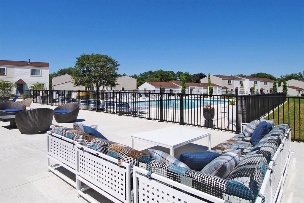 the preserve at ballantyne commons pool and patio area with chairs and a table