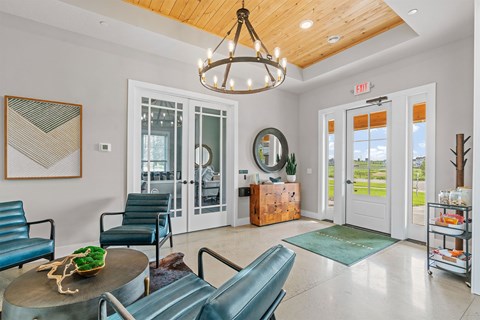 A room with a wooden ceiling and a chandelier.