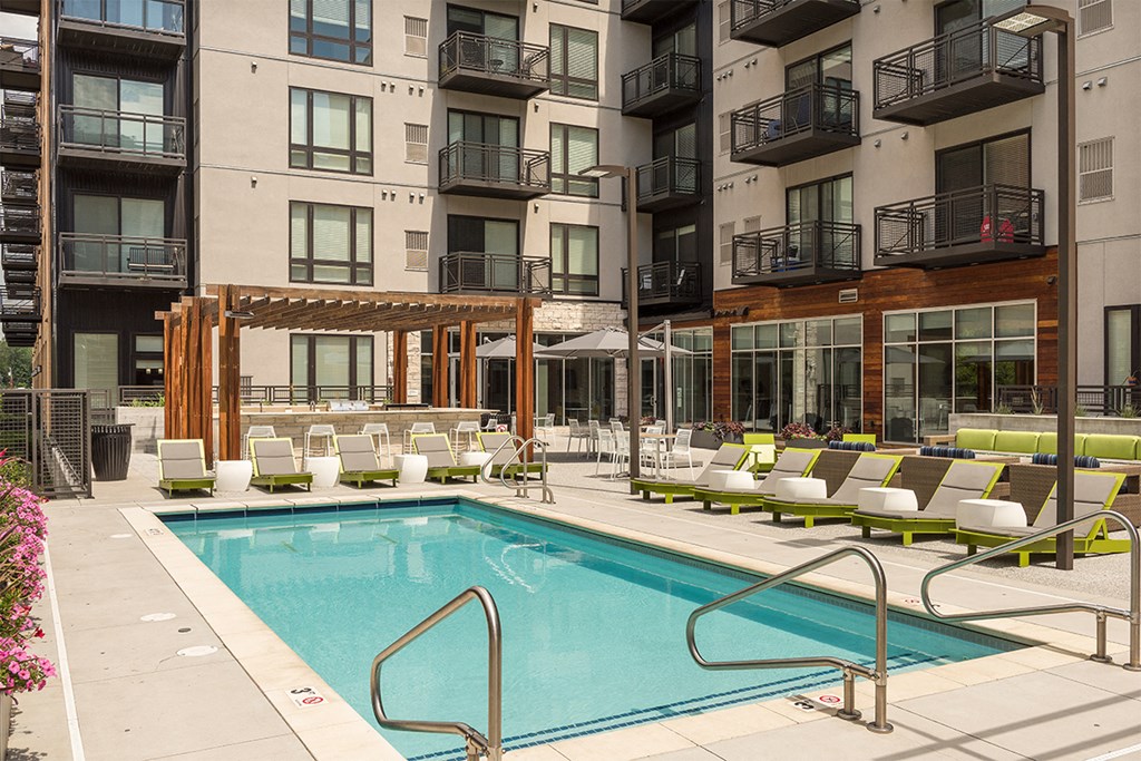 a swimming pool in the middle of an apartment building