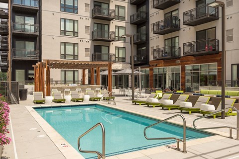 a swimming pool in the middle of an apartment building