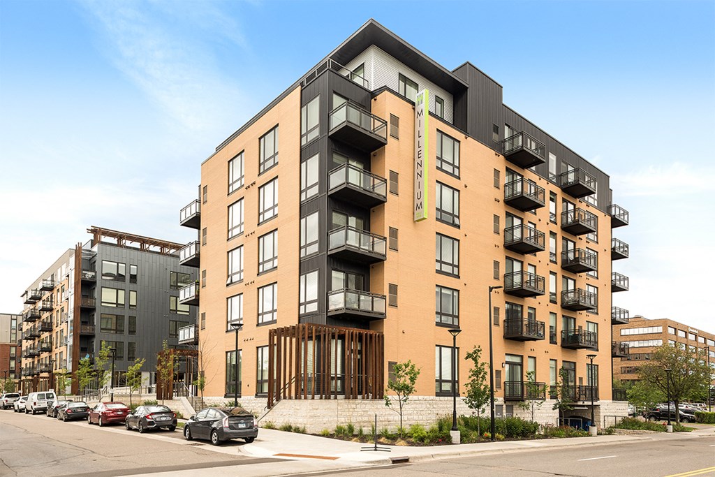 a rendering of an apartment building on a city street