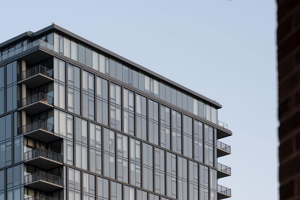 A modern building with a lot of windows and balconies.
