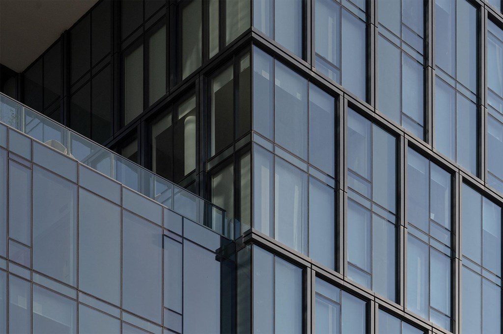 A building with a glass facade and dark frames.
