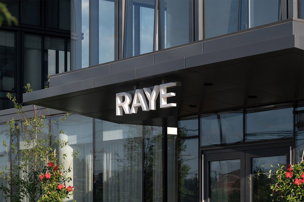 A modern building with the word RAYE on the front.
