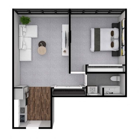 A small room with a bed, a desk, and a microwave.