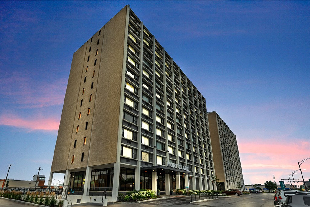 a tall building with a blue sky in the background