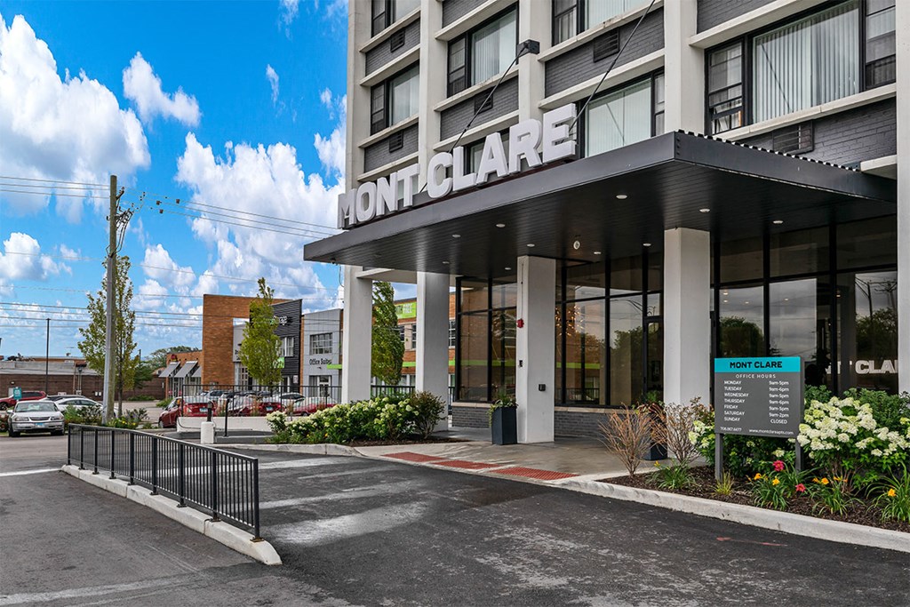 a rendering of the front of a building with a sign on the side of it