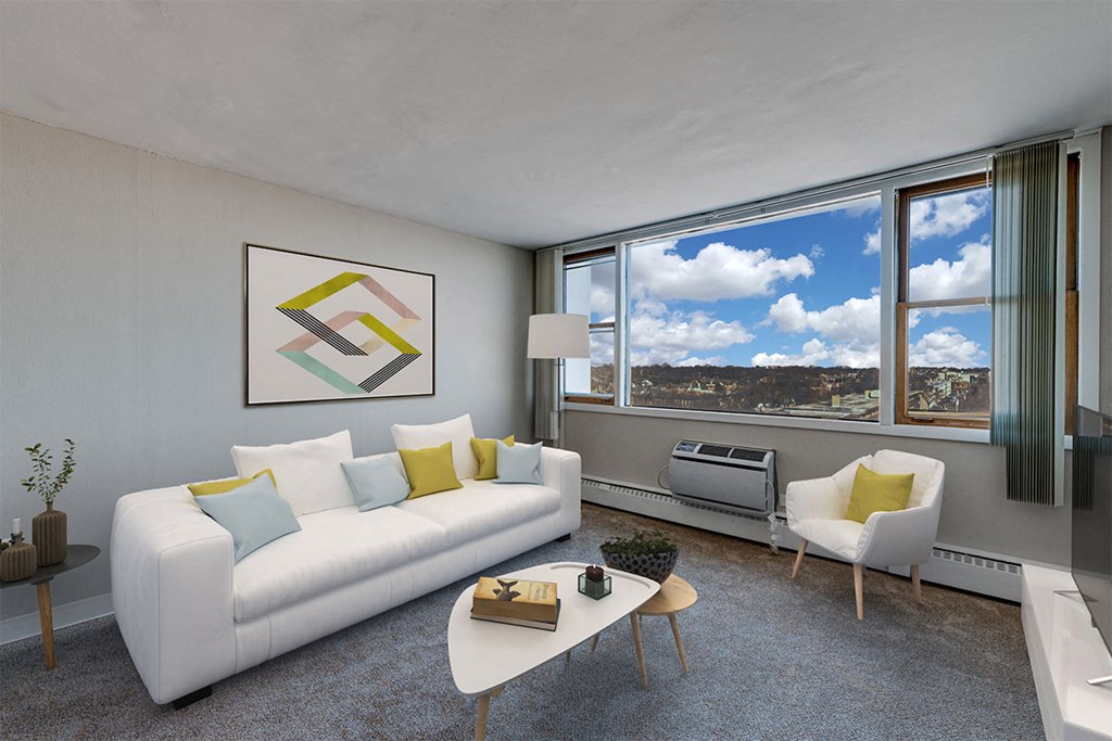 an open living room with a white couch and a table