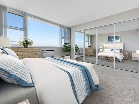 A bedroom with two beds and a large mirror.