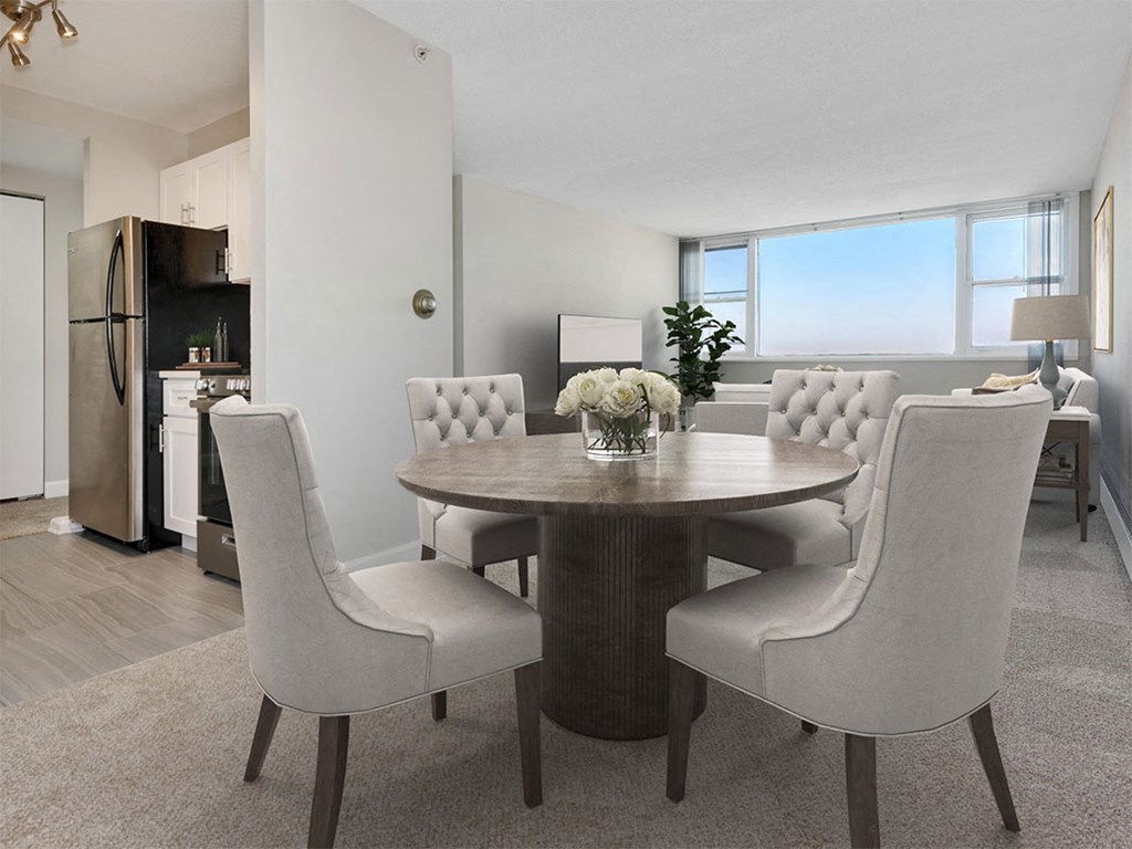 a dining room with a table and chairs