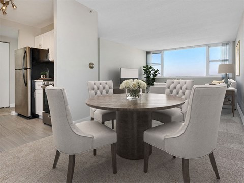 a dining room with a table and chairs