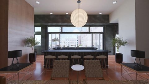 A modern dining room with a large table and chairs.